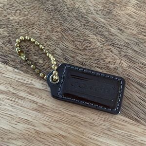 Coach Brown patent leather Hang Tag